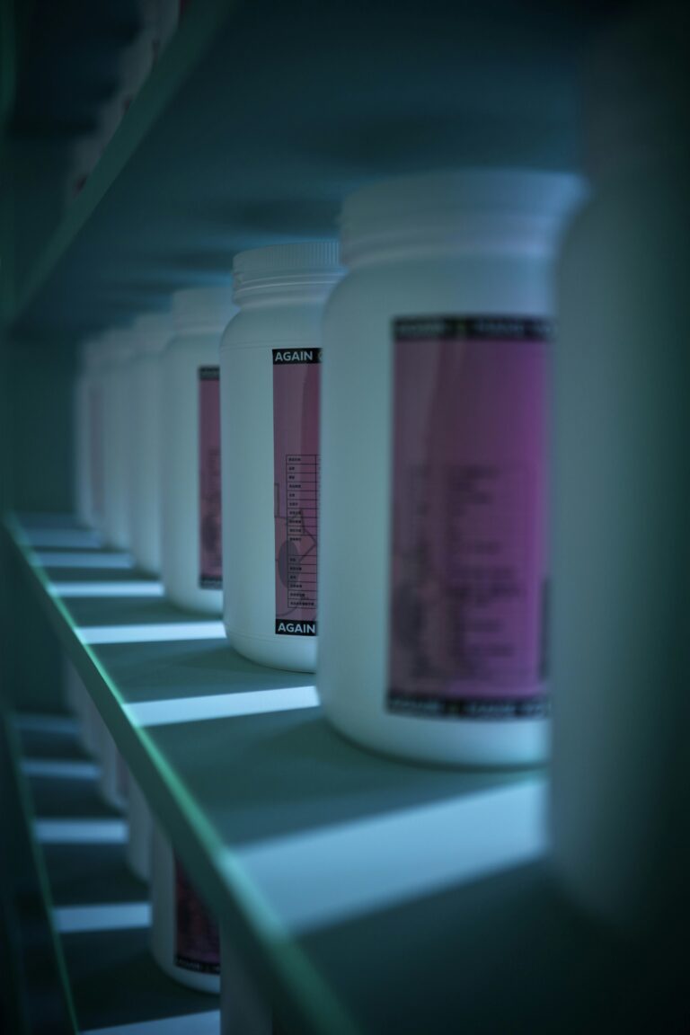 Row of protein powder tubs on a shelf representing the best protein powders for men over 40